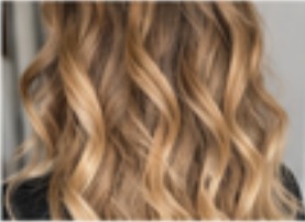 Dimensional blonde balayage with soft grown-out roots