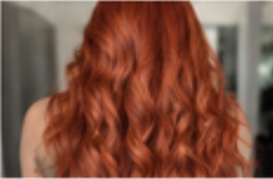 Vivid copper red colour with loose curls